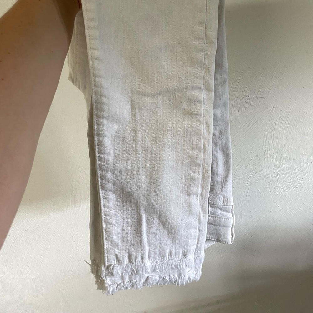 White ankle jeans with fringe bottom from Loft